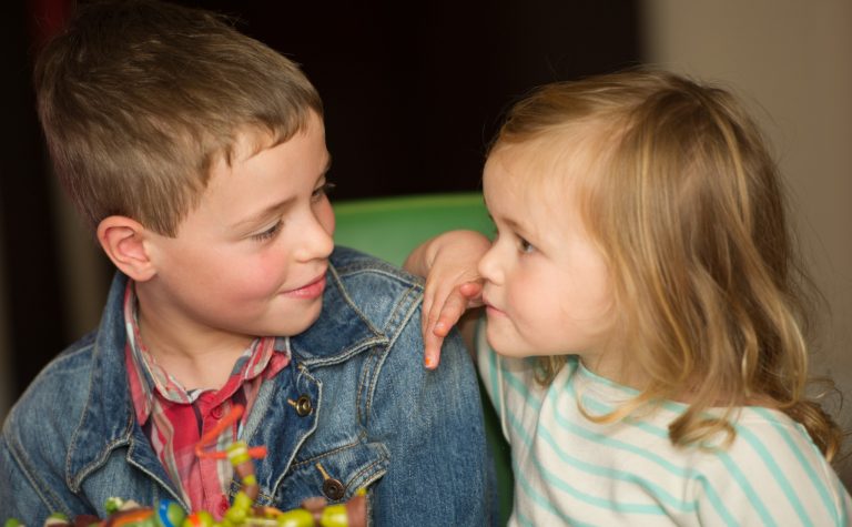 two kids hugging