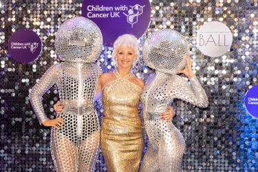 Debbie McGee with glitterball dancers