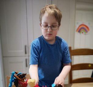 Boy with horse toy