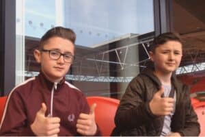 Ethan and Kai with thumbs up