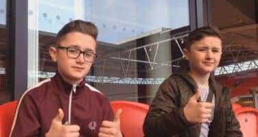 Ethan and Kai with thumbs up