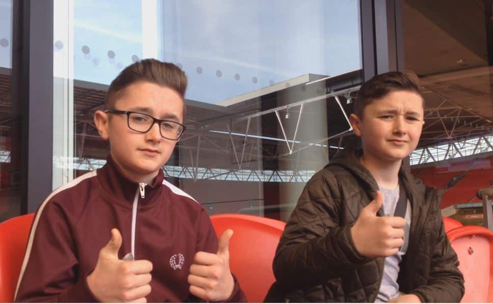 Ethan and Kai with thumbs up