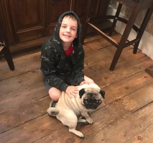 boy with pug dog