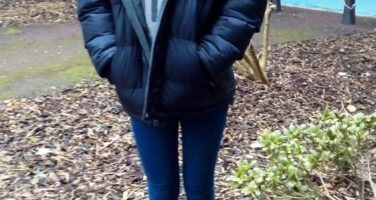 Young girl posing outside