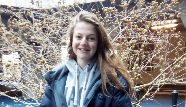 Young girl posing outside