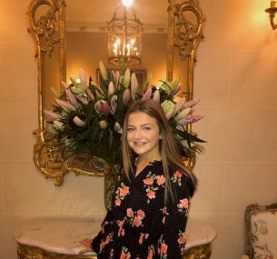 Girl in black floral dress