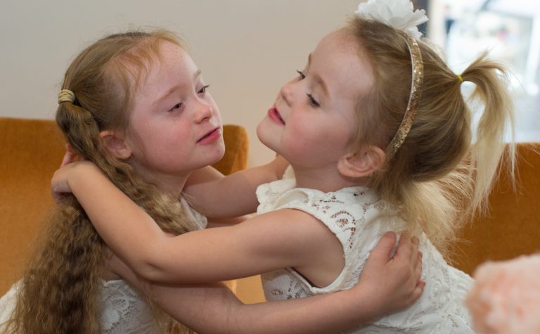 sisters hugging