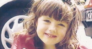 Holly smiles.
