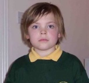 Lex in school uniform, following treatment.