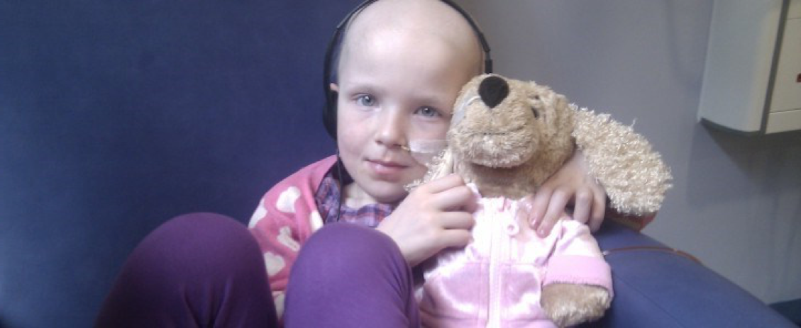 Kidney cancer survivor Niamh, holds a cuddly toy