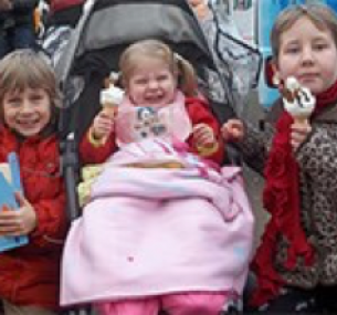 Olivia smiles, holding an ice cream