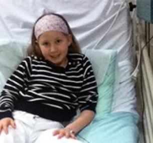 How I found out my child had a brain tumour story: Olivia in hospital bed