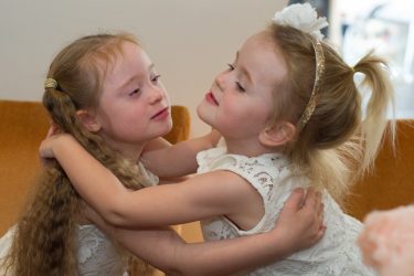 sisters hugging each other