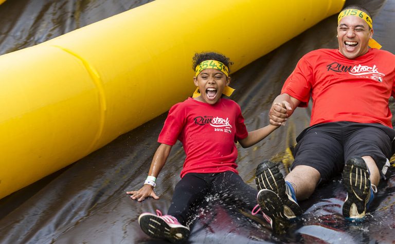 Father & Son sliding down waterslide