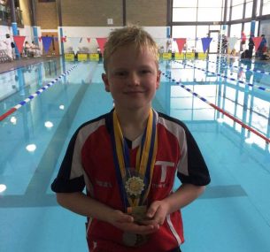 Ross with swimming medals (4)