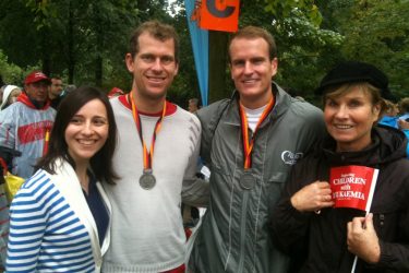 two men with medals and two women