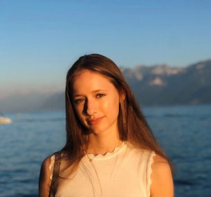 girl standing in front of sea