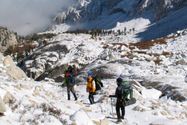 3 people on the mountains