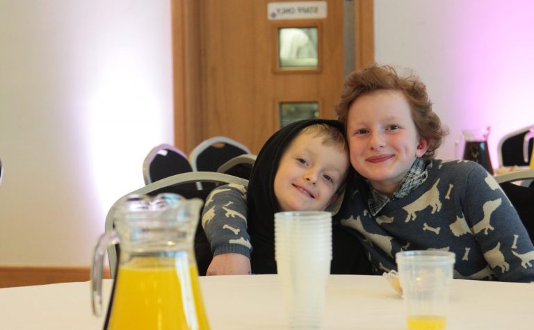 Two young friends sitting together