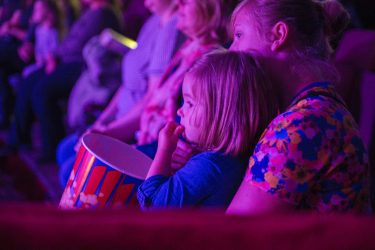 Family eating popcorn at Zippos Circus