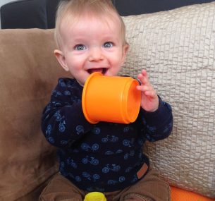 Albie baby boy with orange cup