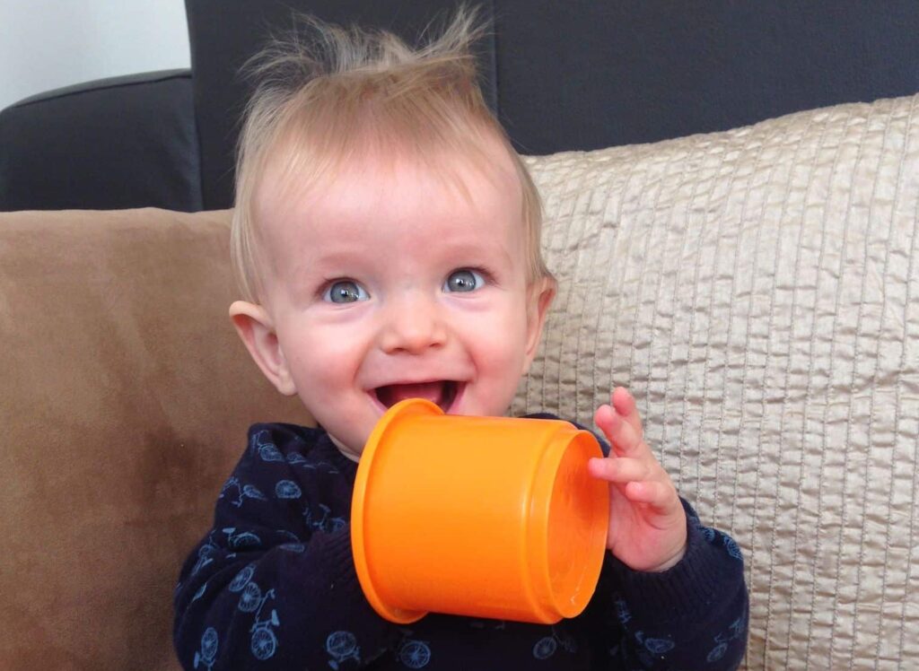 Albie baby boy with orange cup
