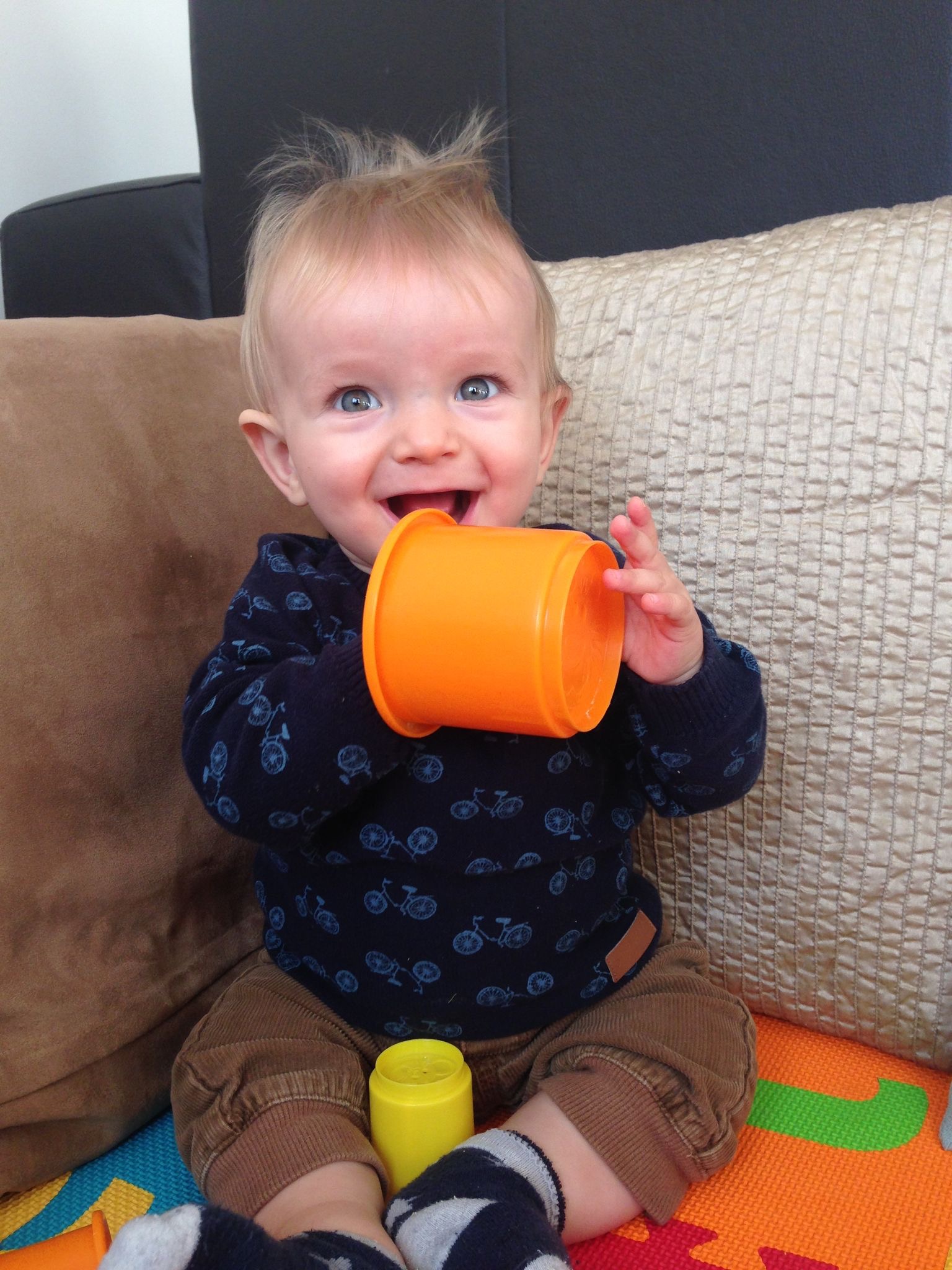 Albie baby boy with orange cup