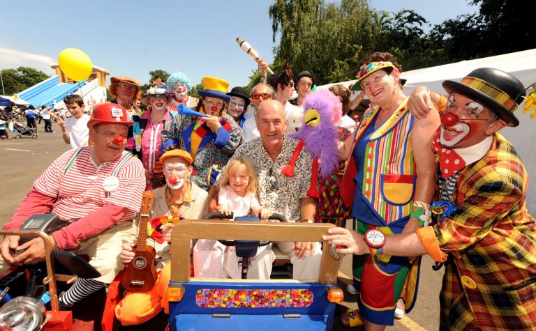 A group of entertainers and children