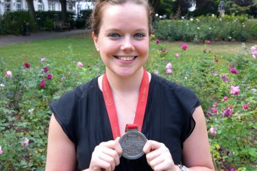 Charlotte showing her London Marathon medal