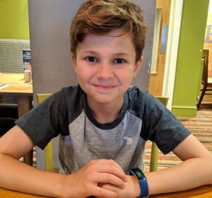 boy sat at table