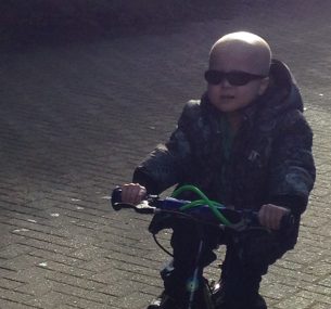 Small child wearing sunglasses