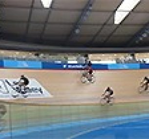 Cyclists going round a velodrome