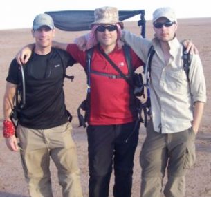 Three men in the desert