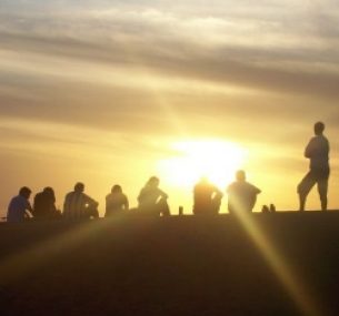 People sitting at sunset