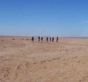 People in the middle of desert