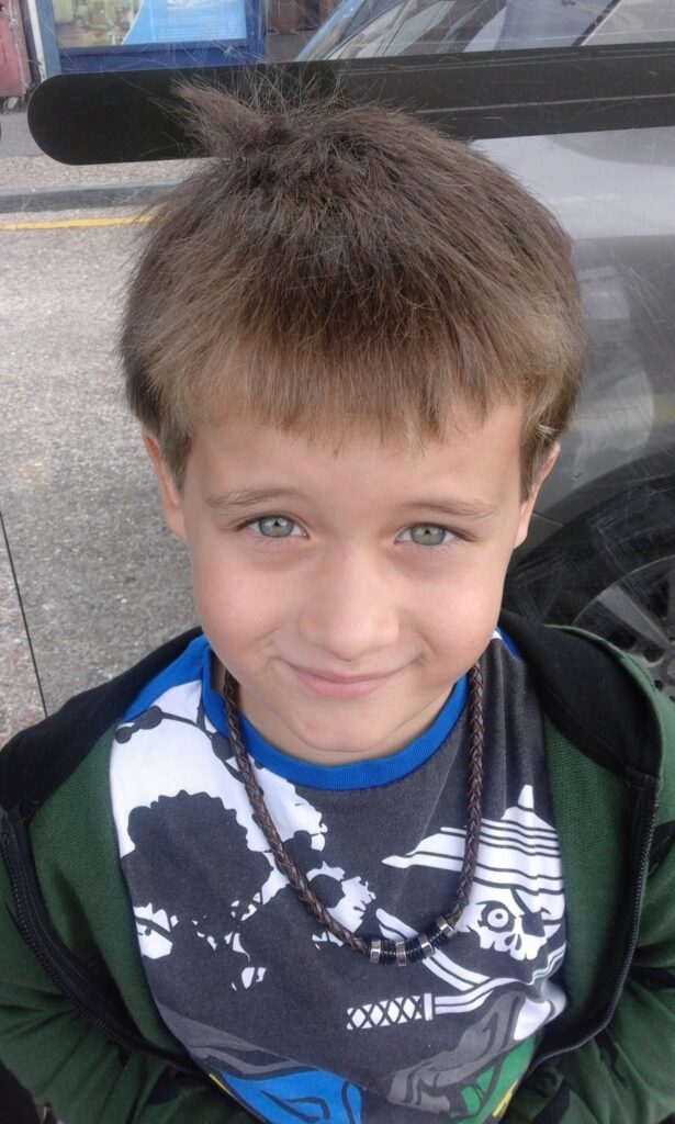 boy with necklace dominic
