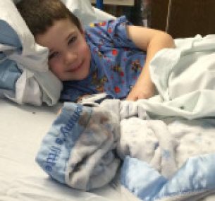 a boy in the hospital bed