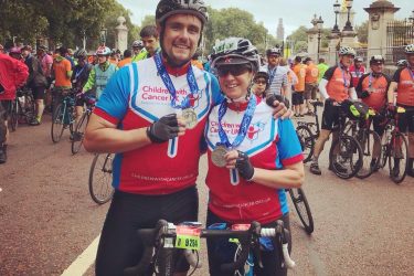 cyclists with medals after completing the Ride London for charity