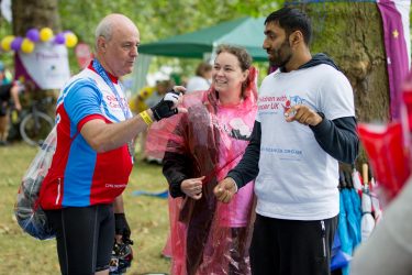 people chatting after taking part in Ford RideLondon charity cycle