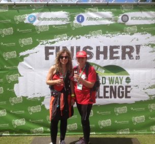 two women with medals and red cap and t-shirt ultra challenge