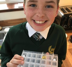 Boy Felix with chemotherapy tables