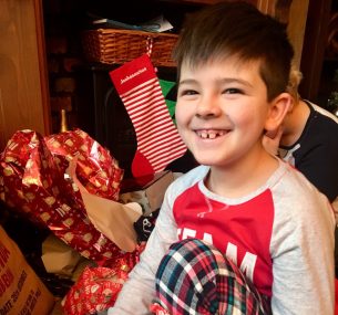 boy in pyjamas josh at christmas 2018