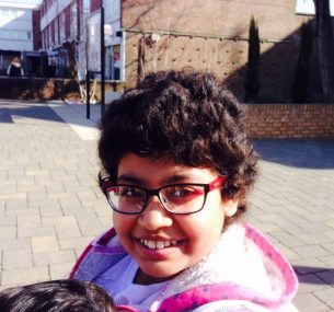 girl with glasses and pink top