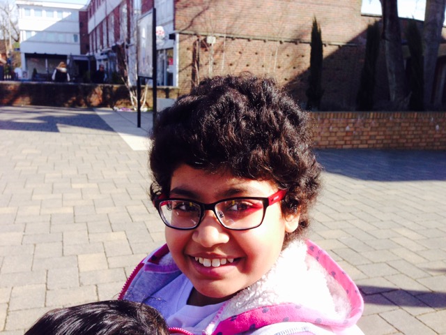 girl with glasses and pink top