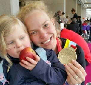 Mum and girl with medal