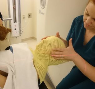 young girl undergoing her radiotherapy session for rhabdomyosarcoma