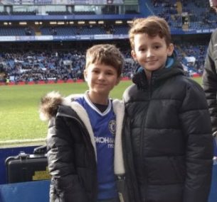 two boys at chelsea football match