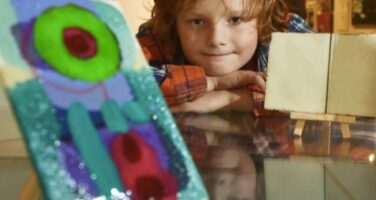 Henry boy with artwork