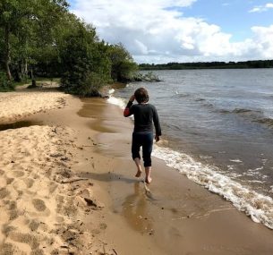 Boy walking on beach