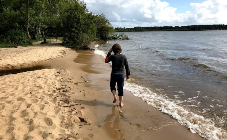 Boy walking on beach